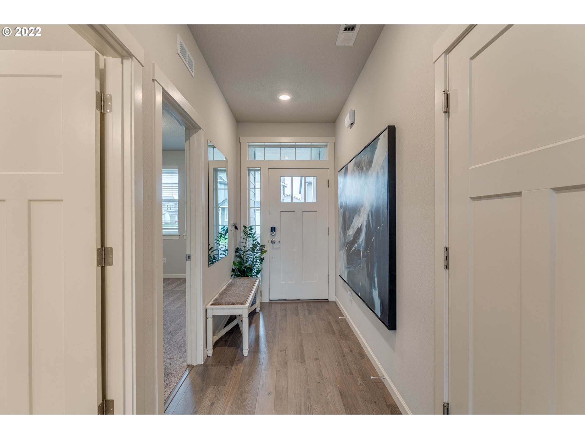 13305 Northeast 114th Way Brush Prairie, WA 98606 - Photo 5 of 31 a hallway with wooden floor and furniture