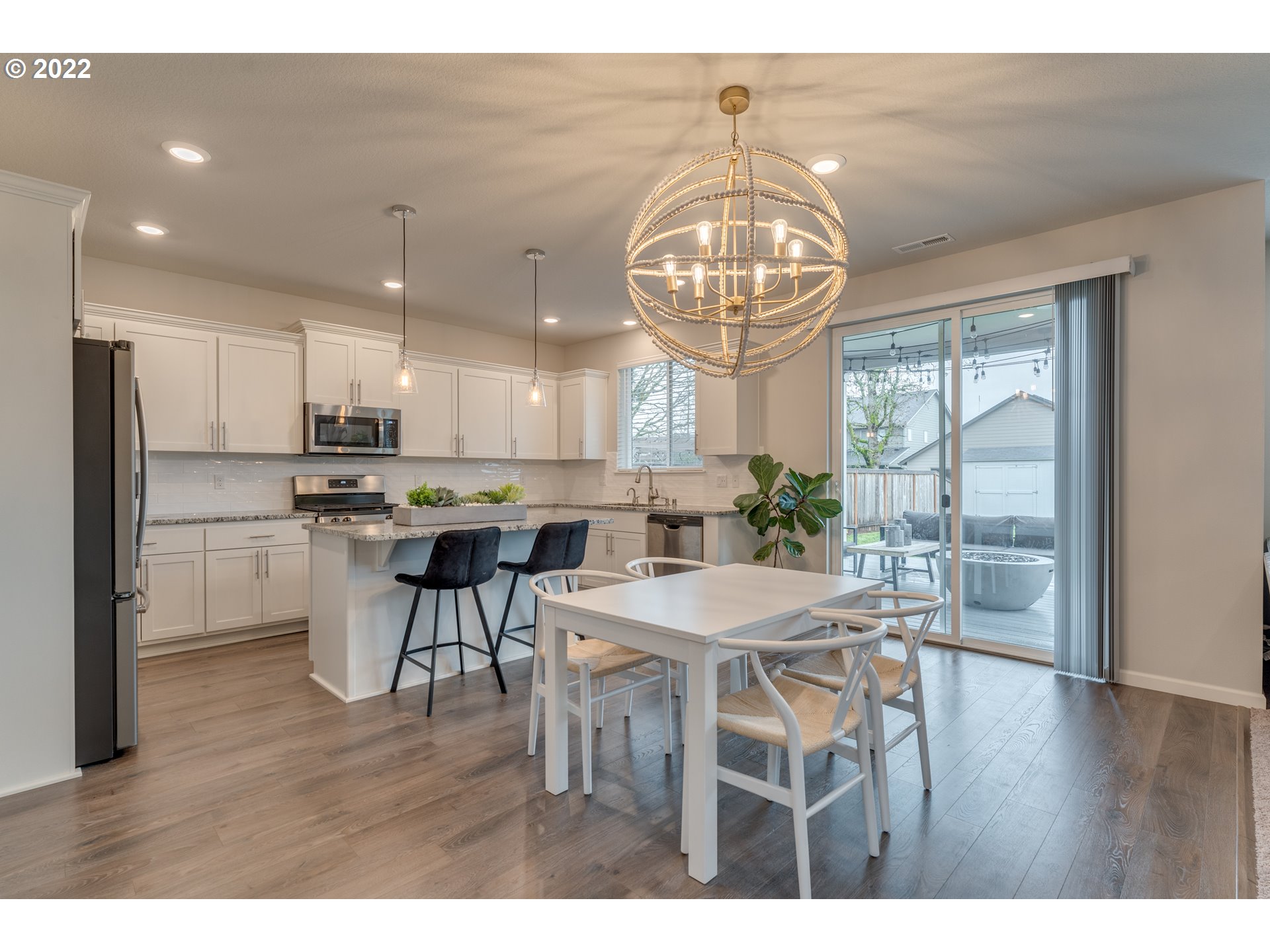 13305 Northeast 114th Way Brush Prairie, WA 98606 - Photo 6 of 31 a view of a dining room with furniture window and wooden floor