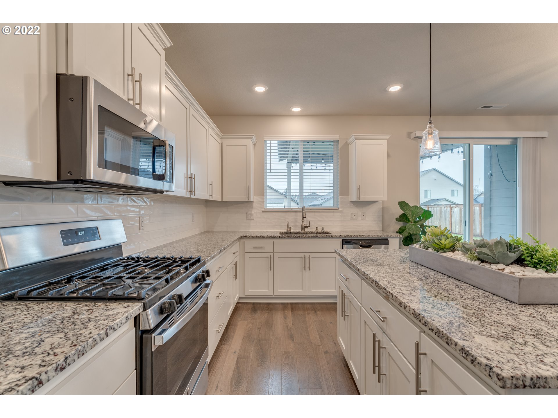 13305 Northeast 114th Way Brush Prairie, WA 98606 - Photo 8 of 31 a kitchen with a sink stove and microwave