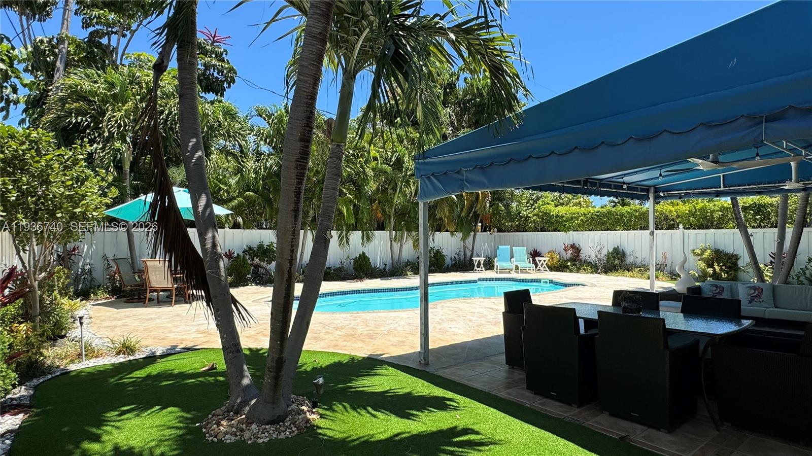 1611 71st Street Miami Beach, FL 33141 - Photo 1 of 16 a view of a backyard with sitting area