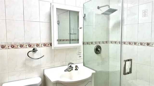 a bathroom with a sink and mirror