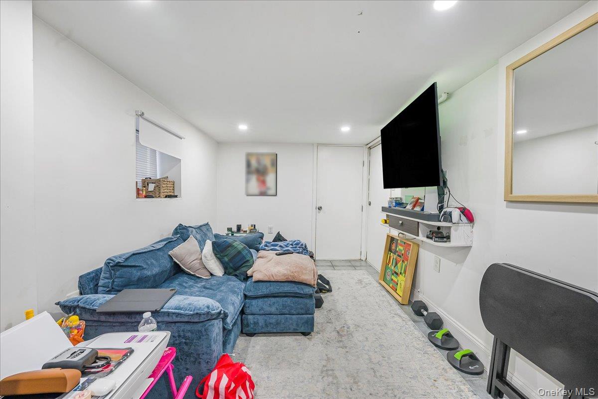 1526 Kennellworth Place Bronx, NY 10465 - Photo 13 of 37 a living room with furniture and a flat screen tv
