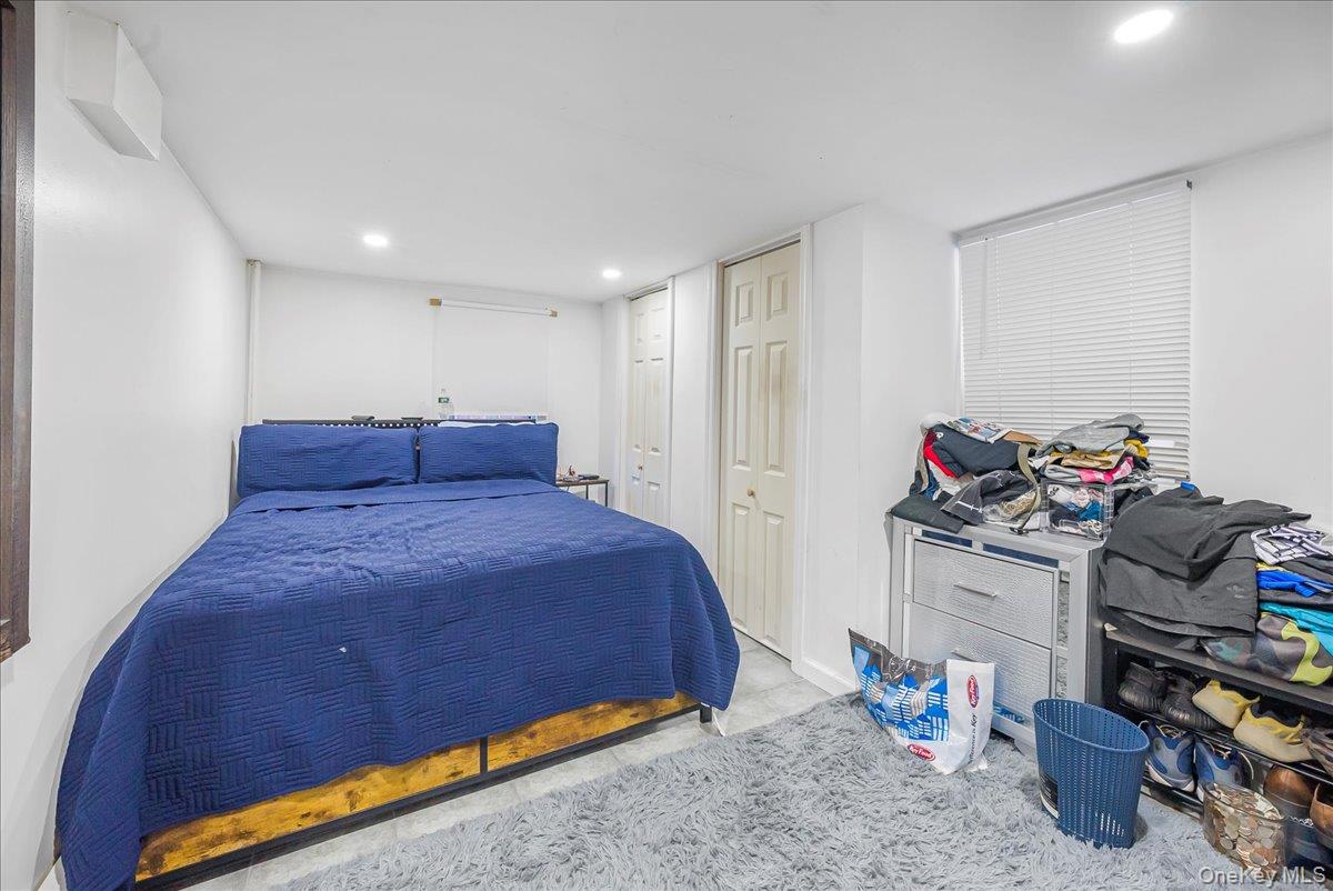 1526 Kennellworth Place Bronx, NY 10465 - Photo 14 of 37 a bedroom with a bed and a window