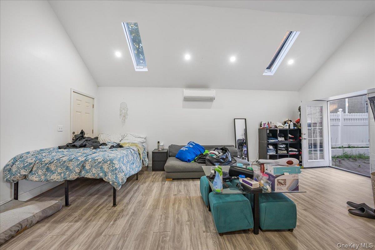1526 Kennellworth Place Bronx, NY 10465 - Photo 20 of 37 a living room with furniture and a wooden floor