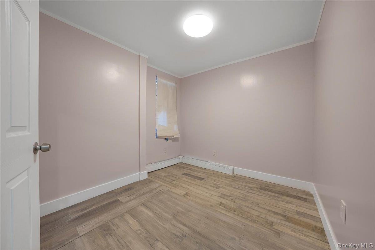 1526 Kennellworth Place Bronx, NY 10465 - Photo 29 of 37 wooden floor in an empty room