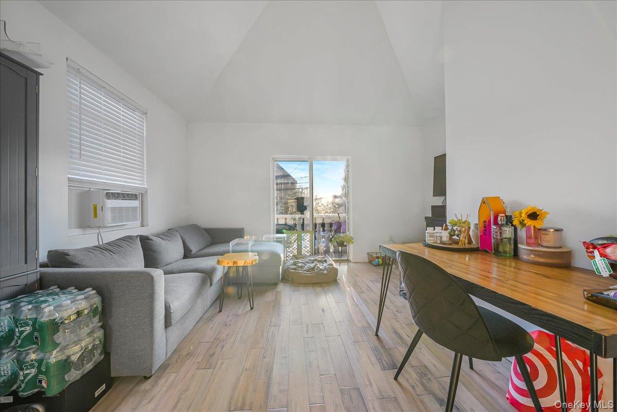 1526 Kennellworth Place Bronx, NY 10465 - Photo 31 of 37 a living room with furniture and a wooden floor