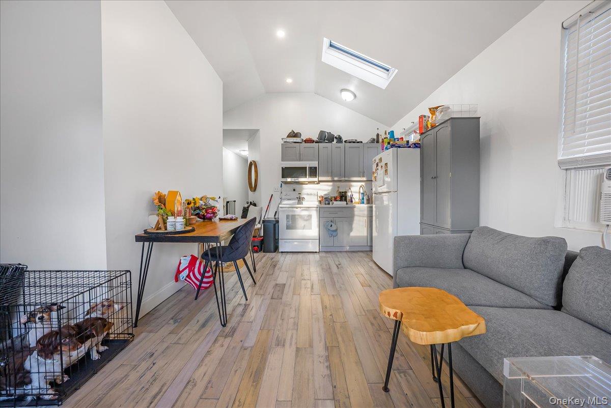 1526 Kennellworth Place Bronx, NY 10465 - Photo 33 of 37 a living room with furniture and a wooden floor