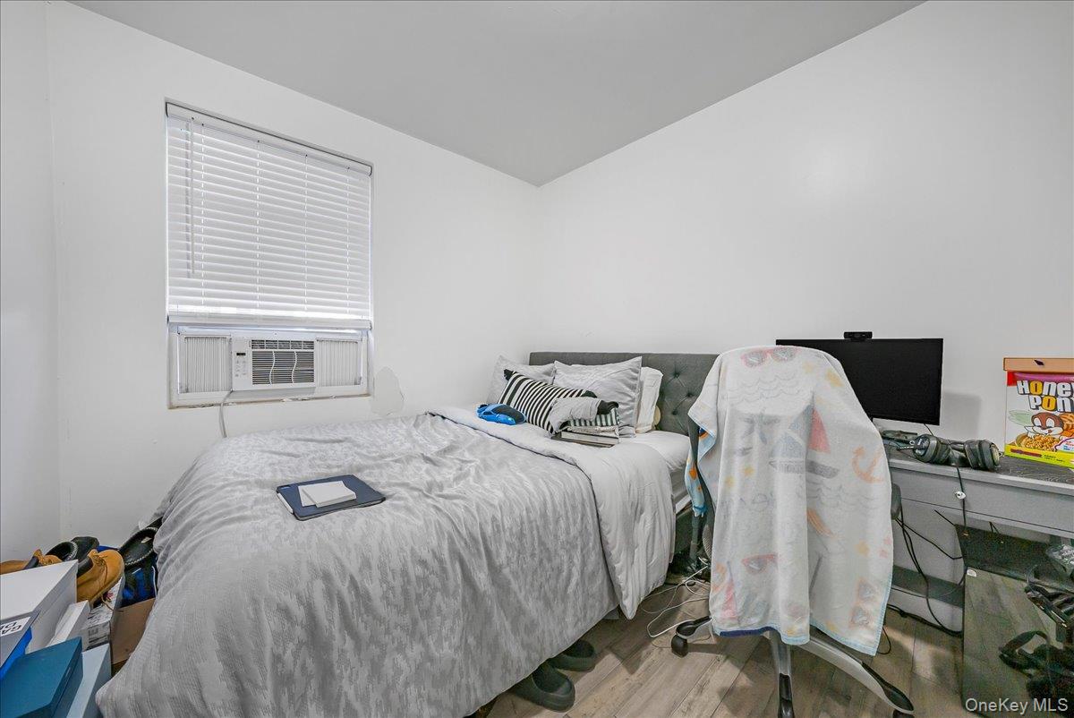 1526 Kennellworth Place Bronx, NY 10465 - Photo 35 of 37 a bedroom with bed and a window