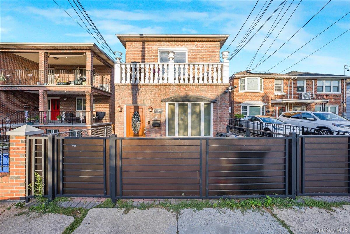 1526 Kennellworth Place Bronx, NY 10465 - Photo 9 of 37 a front view of a house with a garden