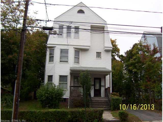 184 Fairview Street New Britain, CT 06051 - Photo 1 of 1 a front view of a residential apartment building with a yard