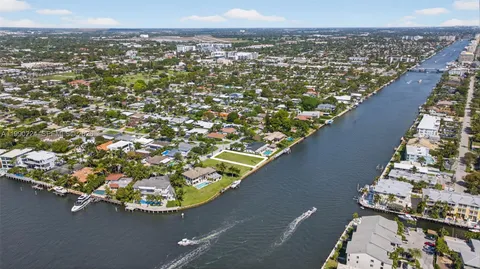 an aerial view of a houses with a yard