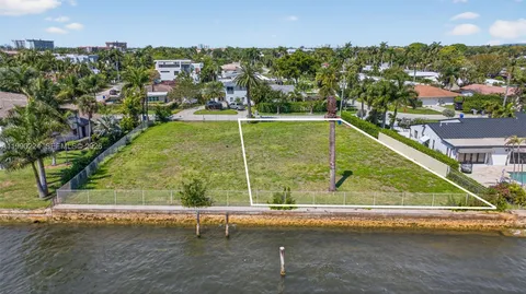 an aerial view of a residential houses with outdoor space