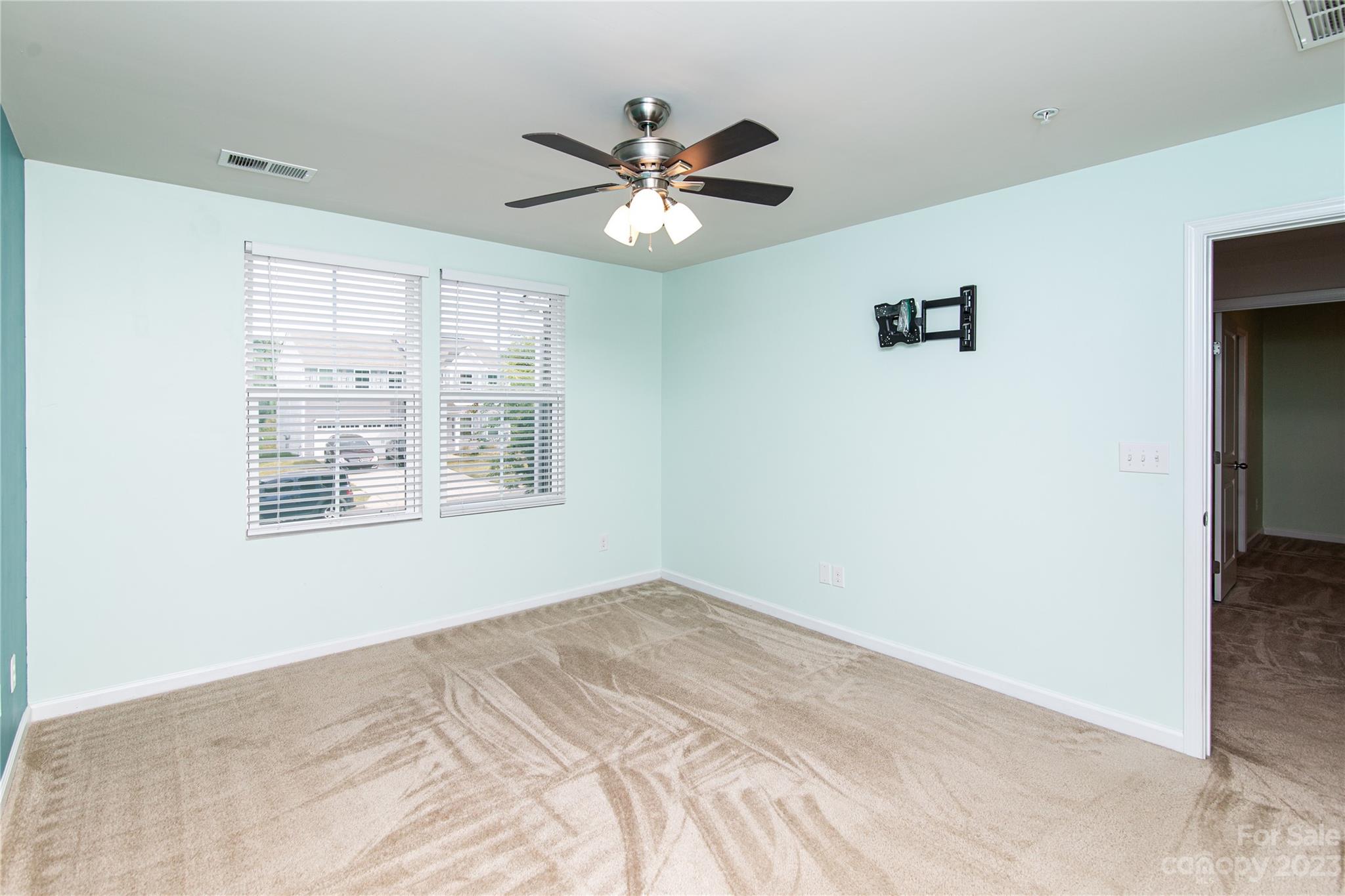 1151 Tangle Ridge Drive Southeast Concord, NC 28025 - Photo 11 of 22 a view of a livingroom with a ceiling fan and window