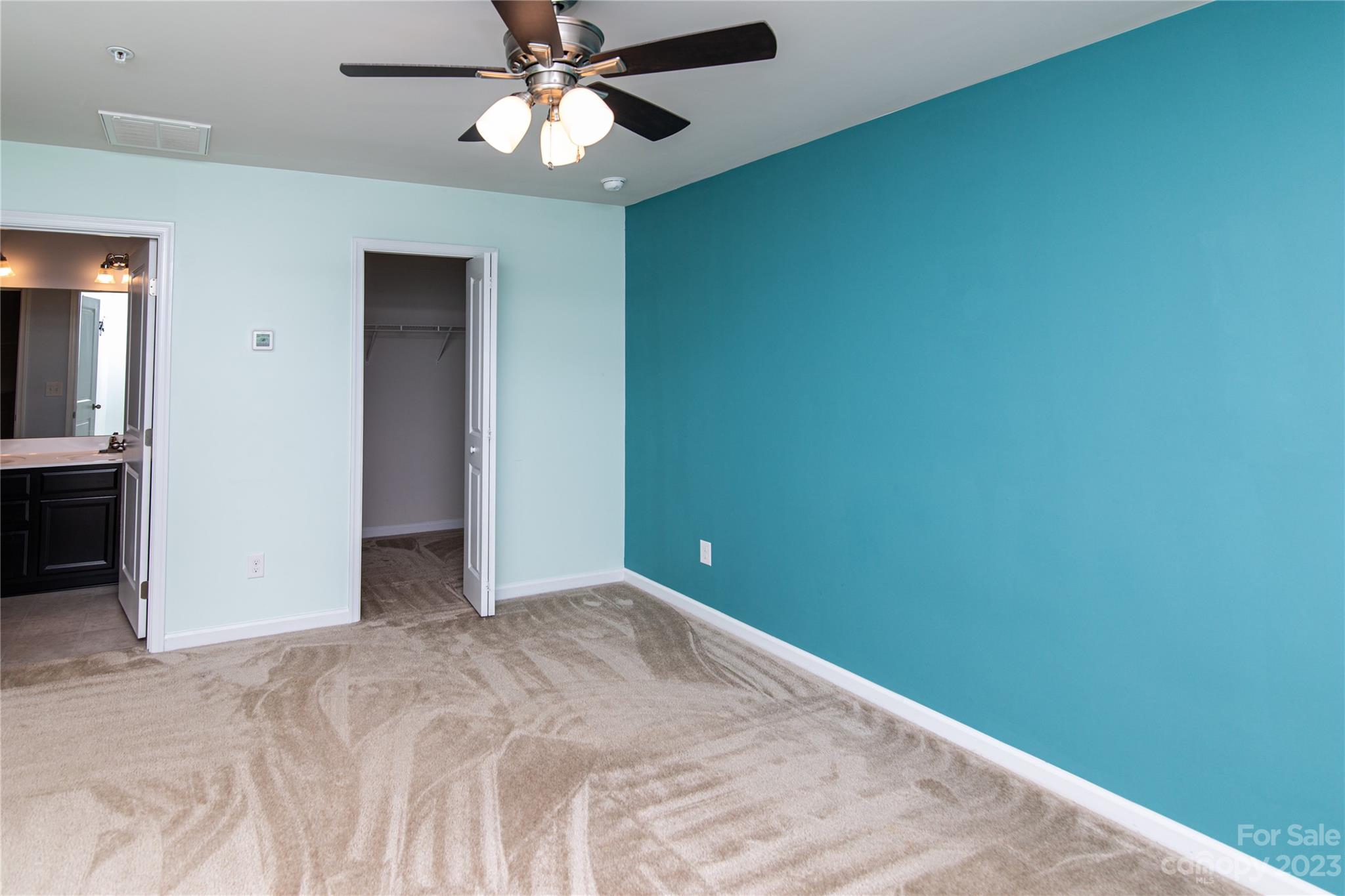 1151 Tangle Ridge Drive Southeast Concord, NC 28025 - Photo 12 of 22 en empty room with a fan and a window