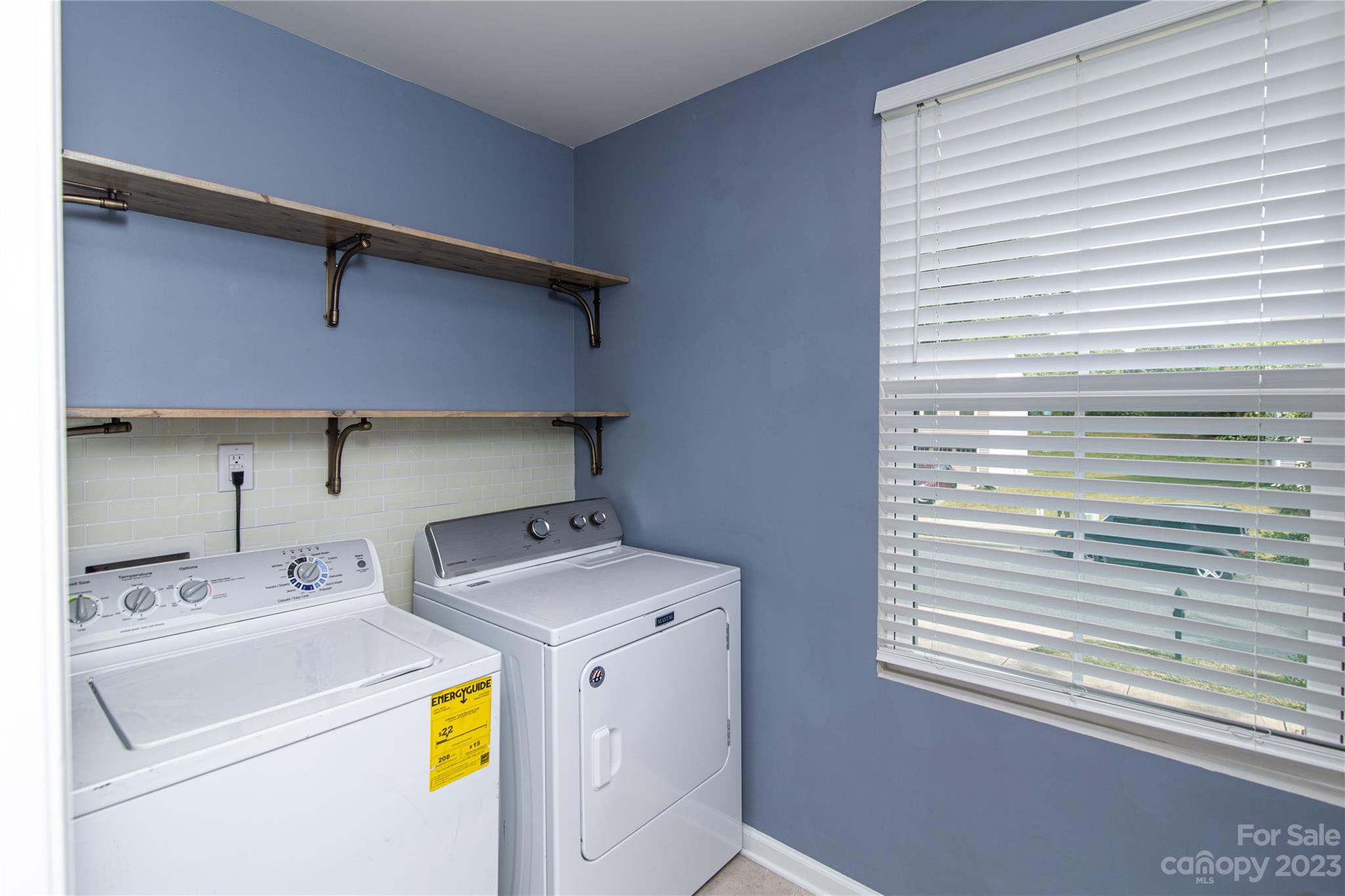 1151 Tangle Ridge Drive Southeast Concord, NC 28025 - Photo 18 of 22 a utility room with dryer and washer