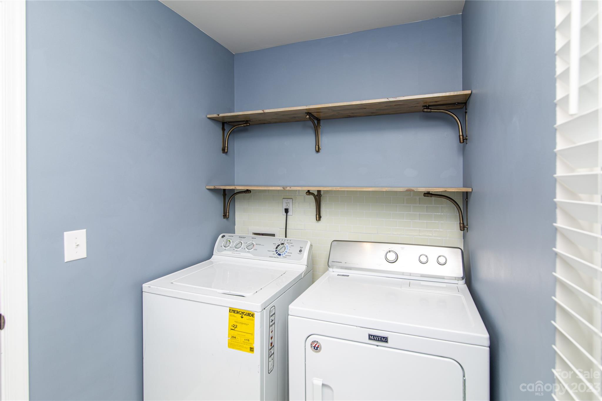 1151 Tangle Ridge Drive Southeast Concord, NC 28025 - Photo 19 of 22 a utility room with dryer and washer