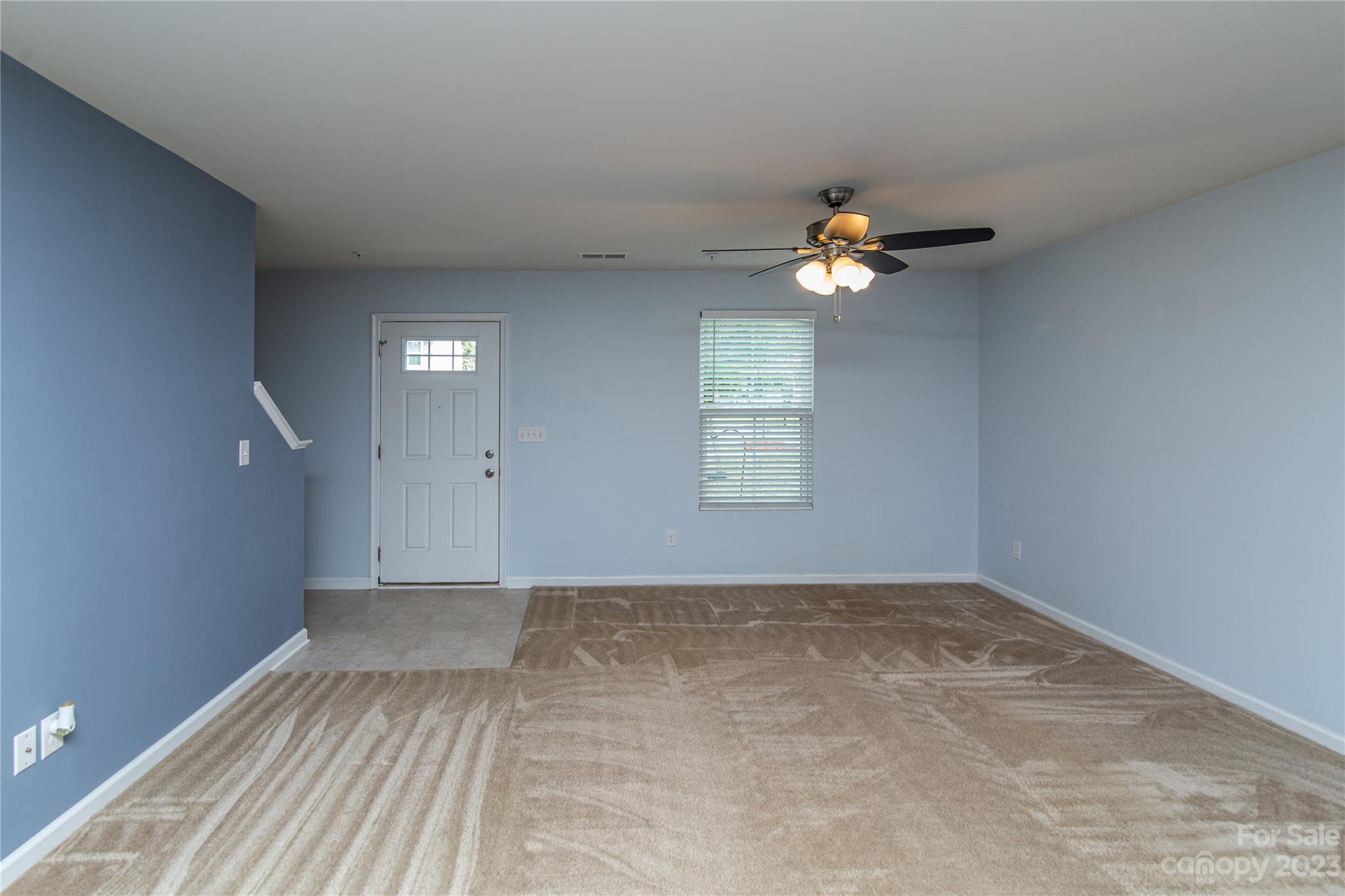 1151 Tangle Ridge Drive Southeast Concord, NC 28025 - Photo 5 of 22 wooden floor in an empty room with a window
