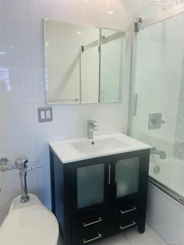 a bathroom with a sink toilet and vanity