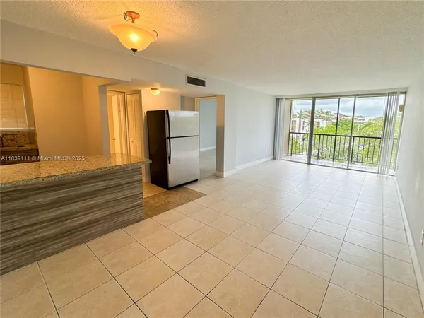 a view of an empty room with a window