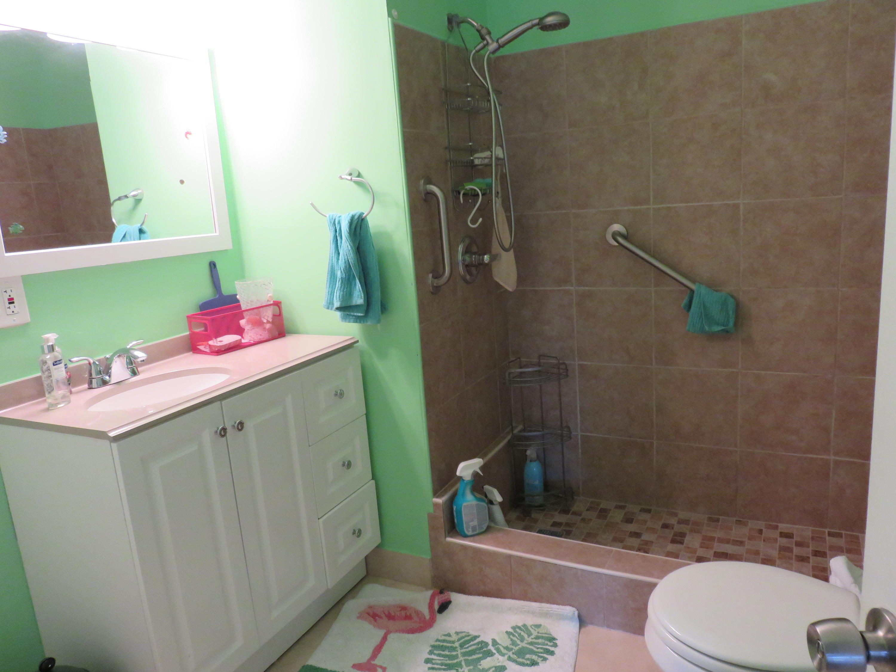 8697 Boca Drive Boca Raton, FL 33433 - Photo 6 of 8 a bathroom with a sink toilet and shower