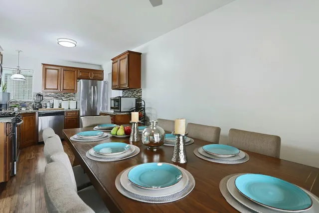 a kitchen with a table and chairs in it