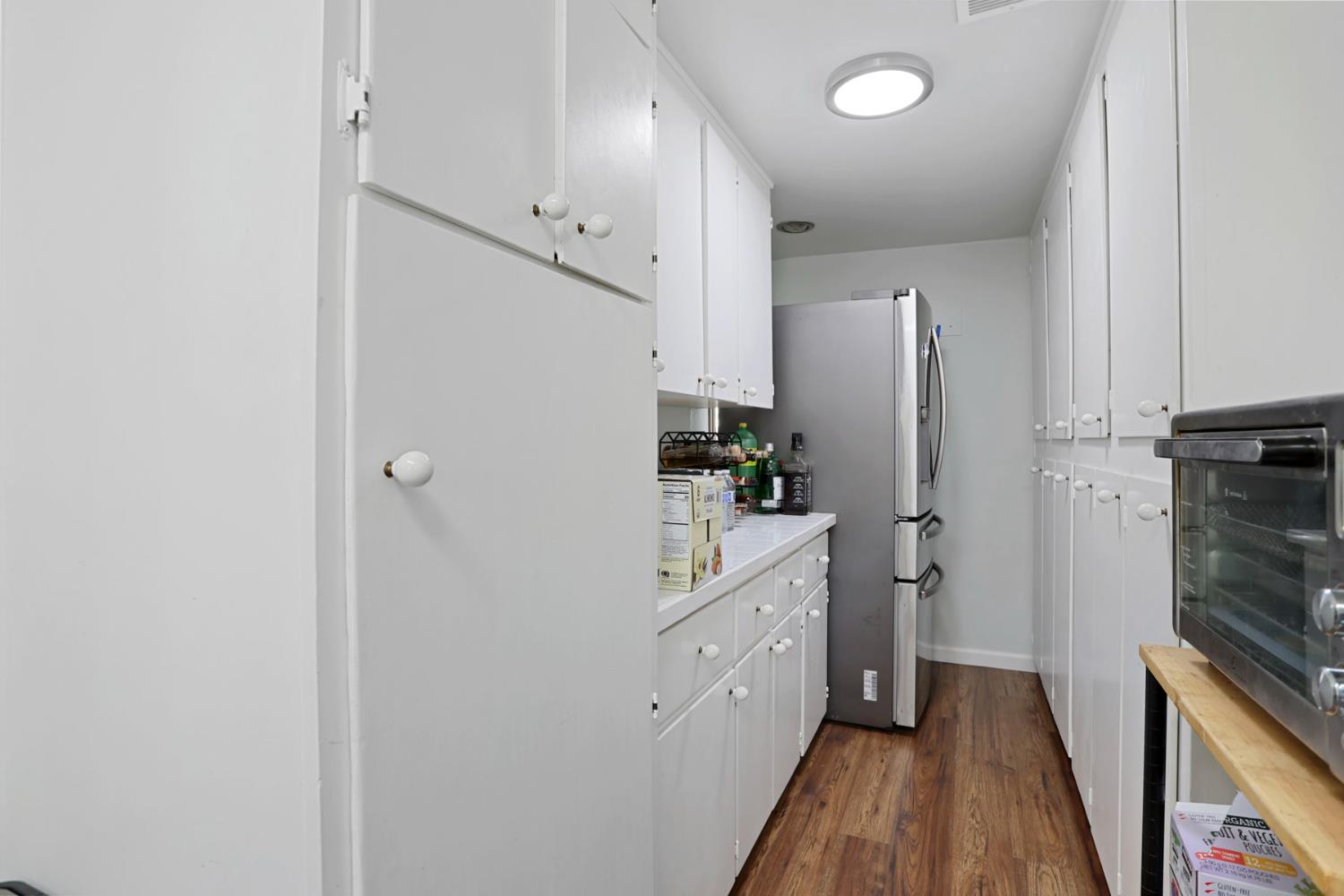 518 West Lincoln Road Stockton, CA 95207 - Photo 18 of 38 a kitchen with stainless steel appliances a refrigerator sink and stove