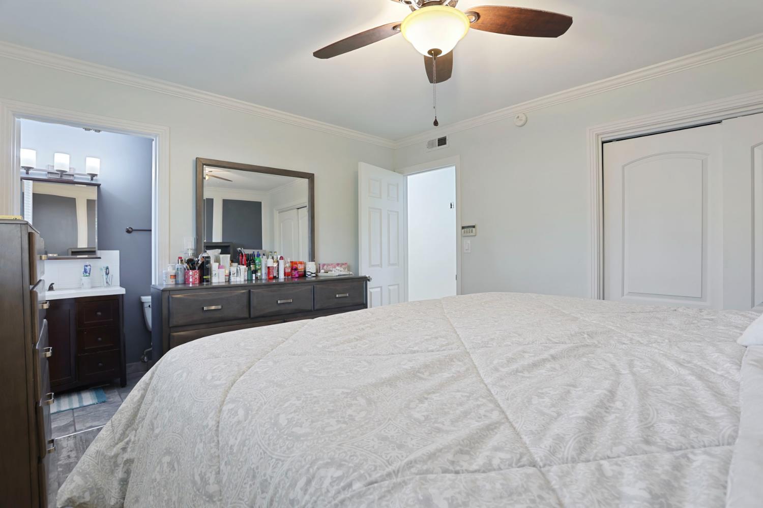 518 West Lincoln Road Stockton, CA 95207 - Photo 21 of 38 a bedroom with a bed and a mirror on the dresser