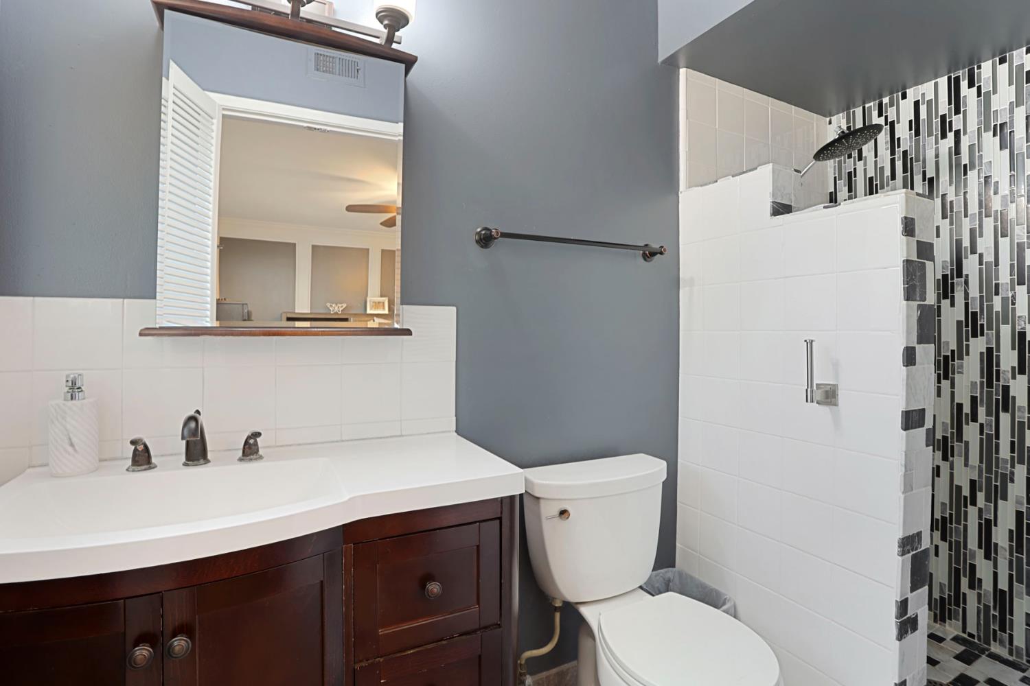 518 West Lincoln Road Stockton, CA 95207 - Photo 22 of 38 a white toilet sitting next to a bathroom sink