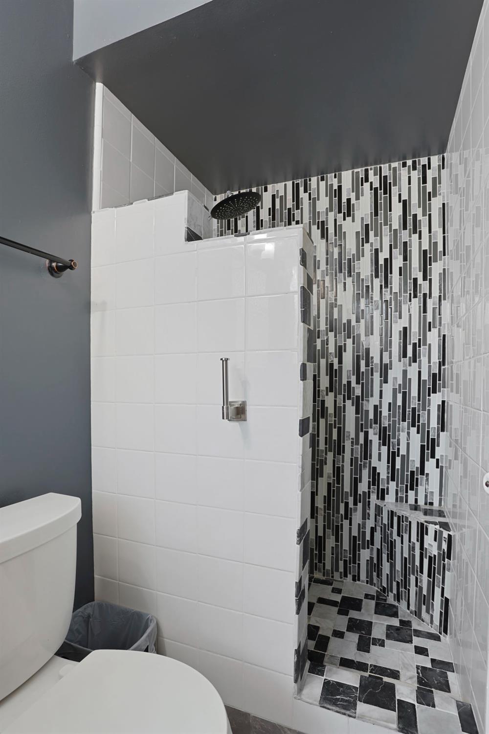 518 West Lincoln Road Stockton, CA 95207 - Photo 23 of 38 a white toilet sitting next to a shower curtain