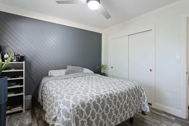 a bedroom with a bed and closet