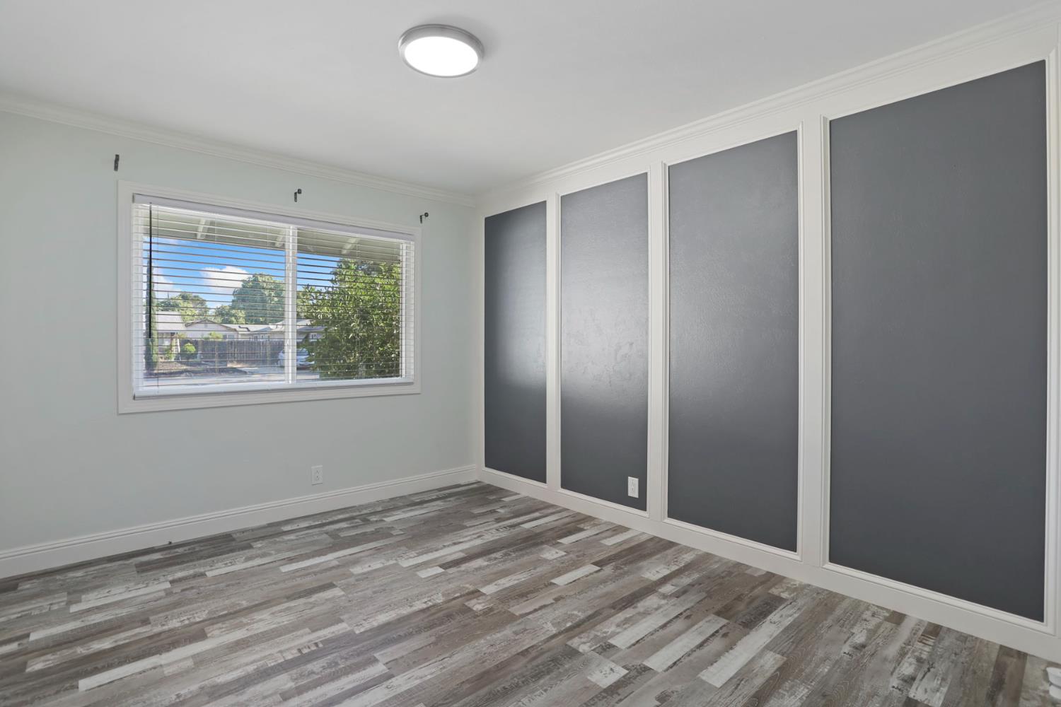 518 West Lincoln Road Stockton, CA 95207 - Photo 26 of 38 a view of a livingroom with wooden floor and window