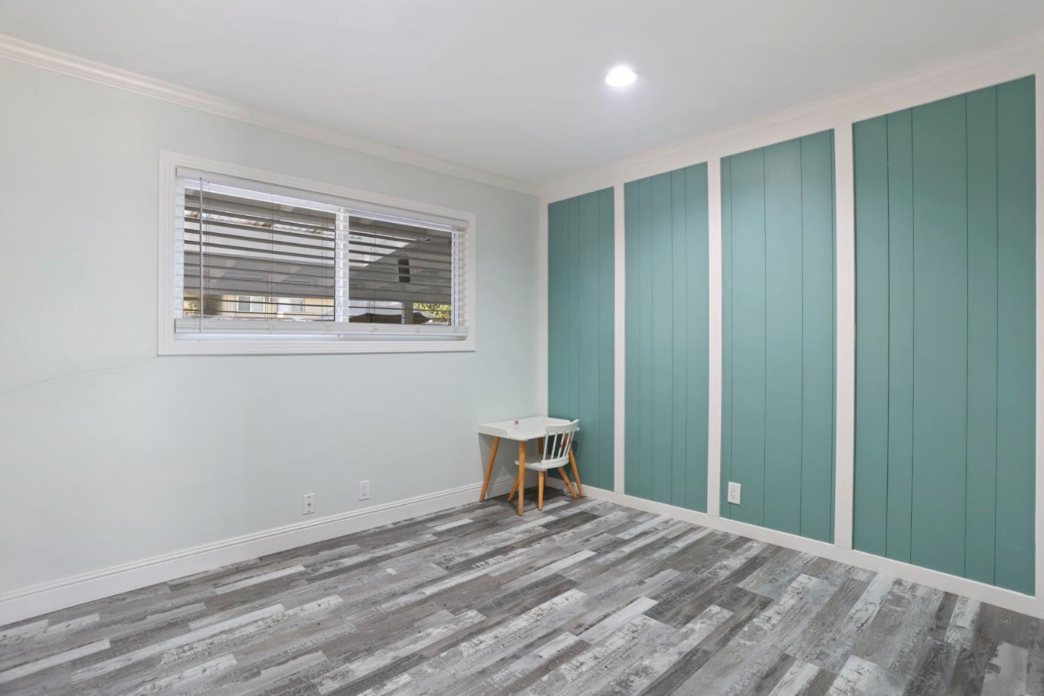 518 West Lincoln Road Stockton, CA 95207 - Photo 28 of 38 a view of a room with wooden floor and chair