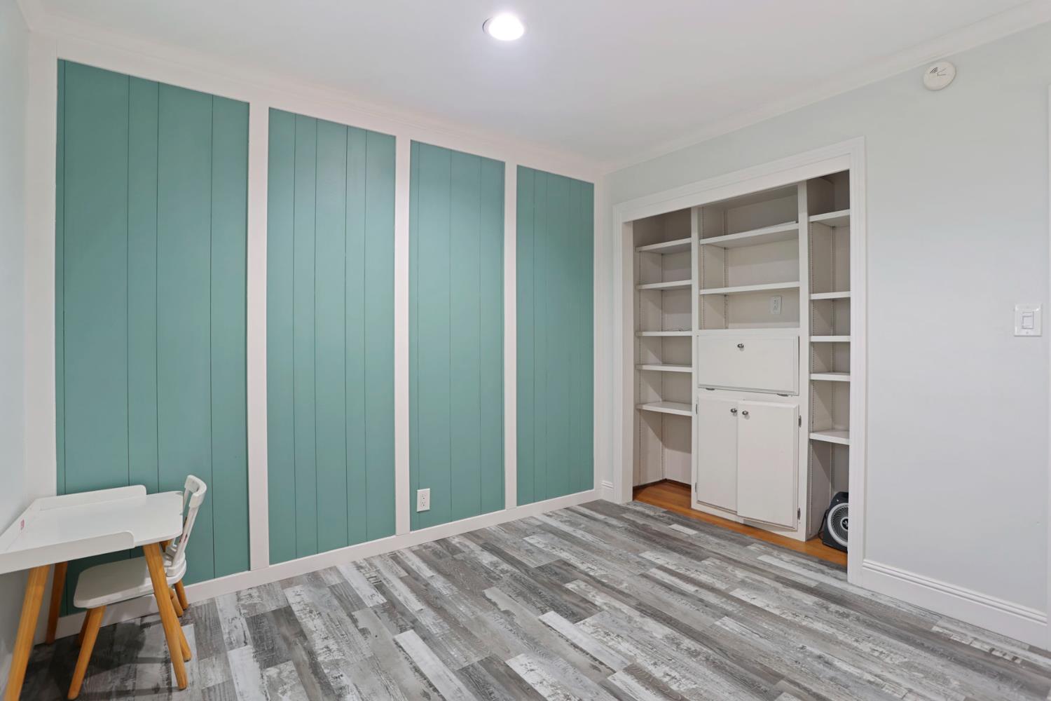 518 West Lincoln Road Stockton, CA 95207 - Photo 29 of 38 a bedroom with a bed and a table in it