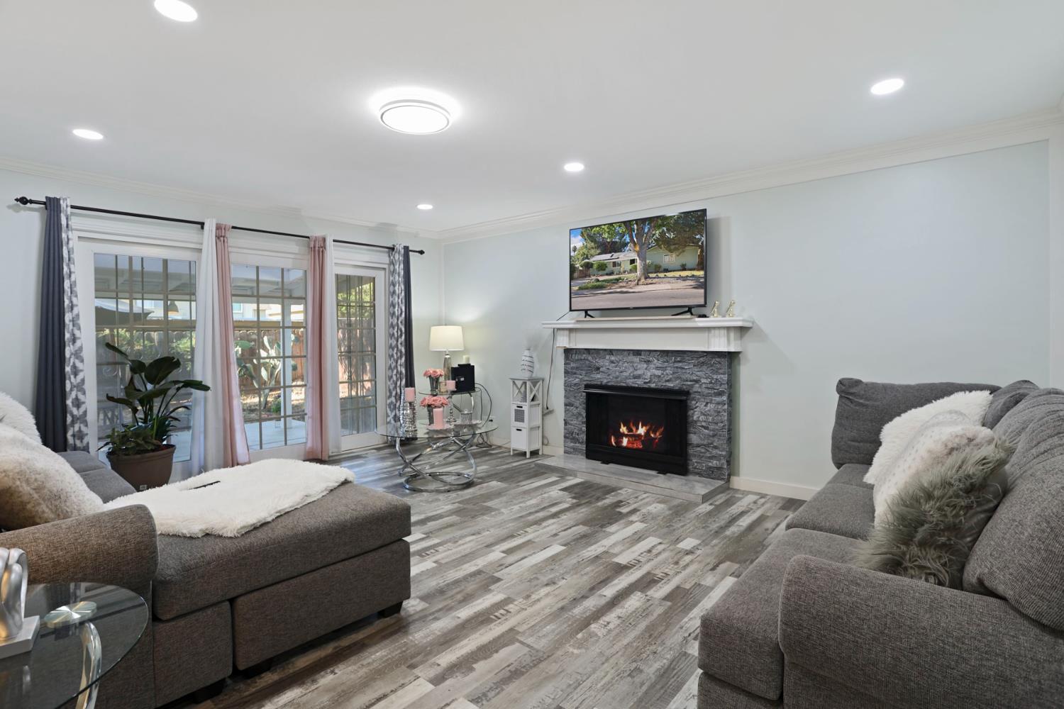 518 West Lincoln Road Stockton, CA 95207 - Photo 6 of 38 a living room with furniture and a fireplace