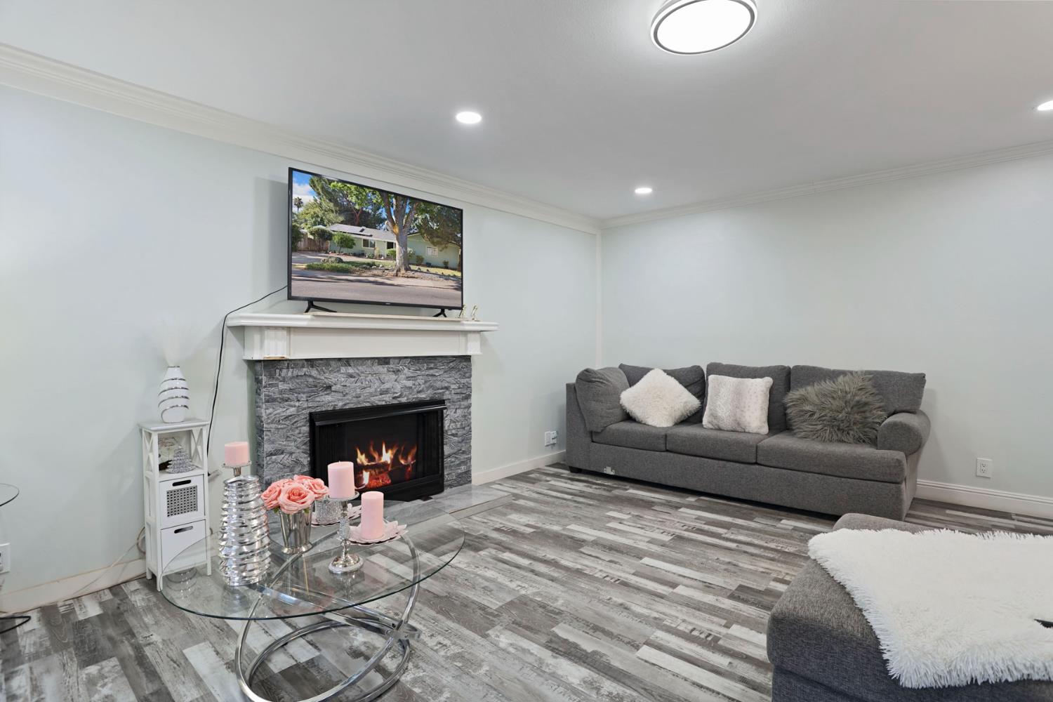 518 West Lincoln Road Stockton, CA 95207 - Photo 9 of 38 a living room with furniture and a fireplace