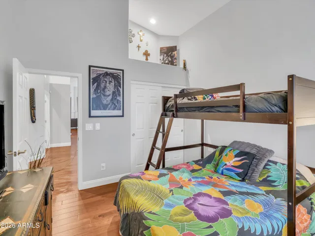 a bathroom with a tub a sink and a large mirror