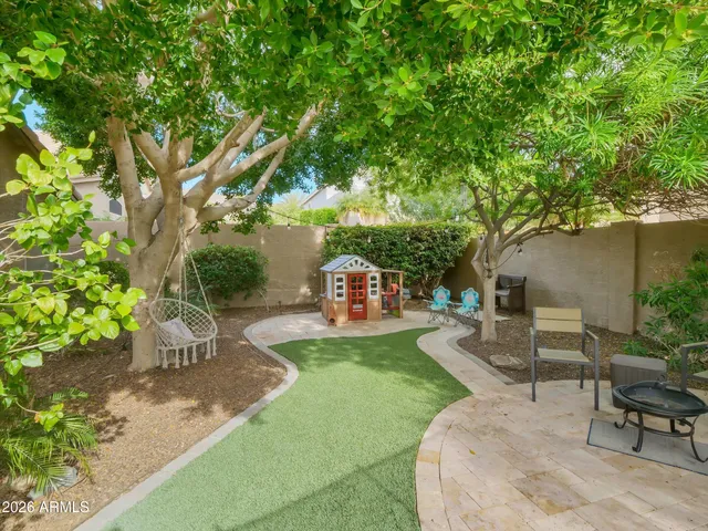 a view of a backyard with sitting area