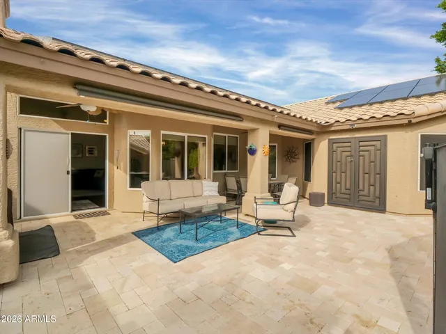 a view of a dining room with a table and chairs