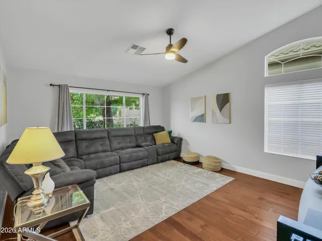 a living room with furniture and a window