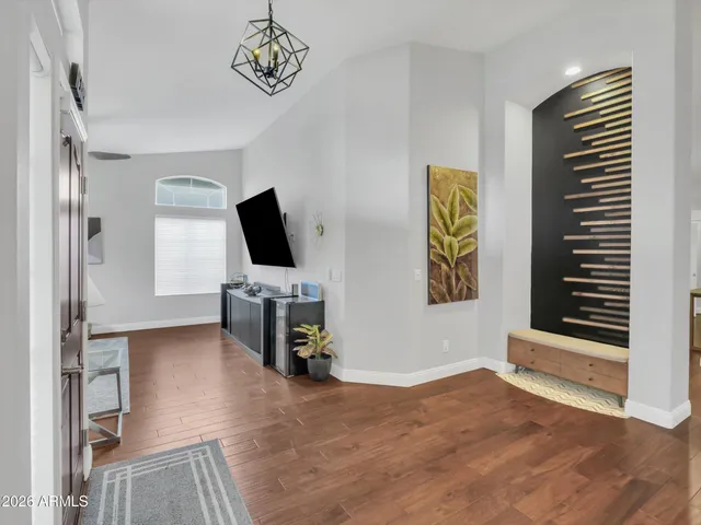 a view of a livingroom with furniture and a flat screen tv