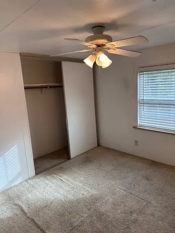 a white refrigerator freezer and a stove sitting inside of a kitchen