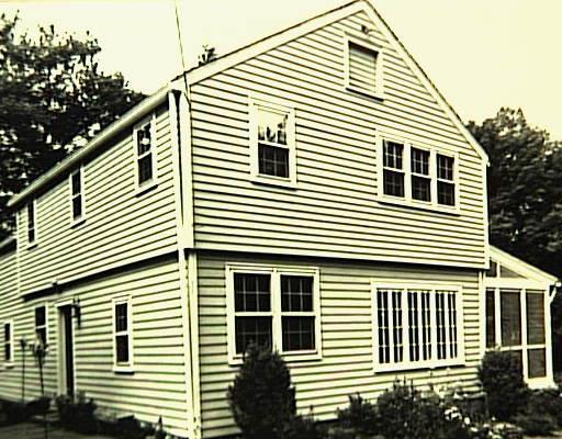 a view of a house with windows and yard