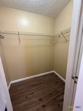 a view of a room with racks on the wall