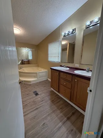 a room with wooden floors and utility room