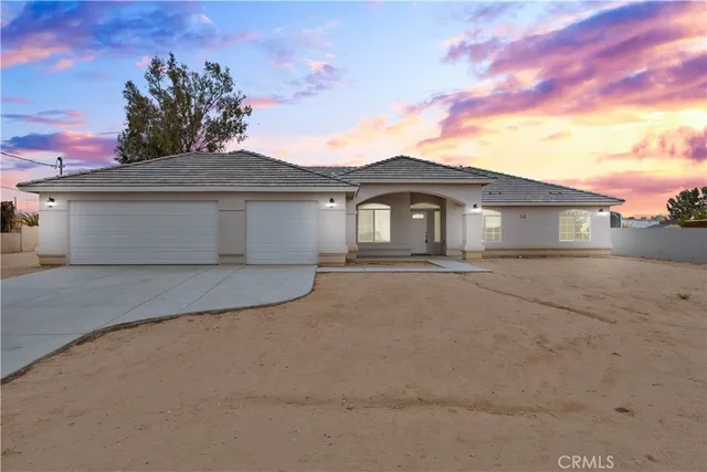 a front view of a house with a garage
