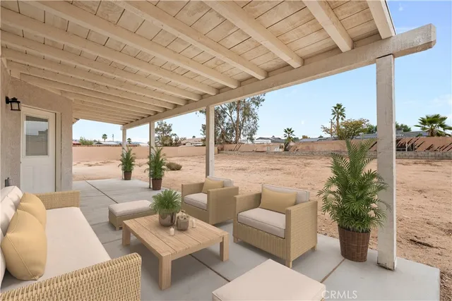 a outdoor living space with furniture and garden view