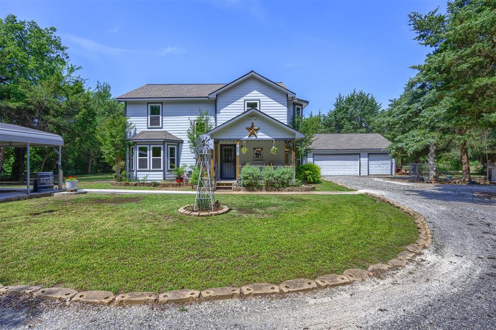 881 Wild Road Van Alstyne, TX 75495 - Photo 1 of 40 a front view of a house with a yard