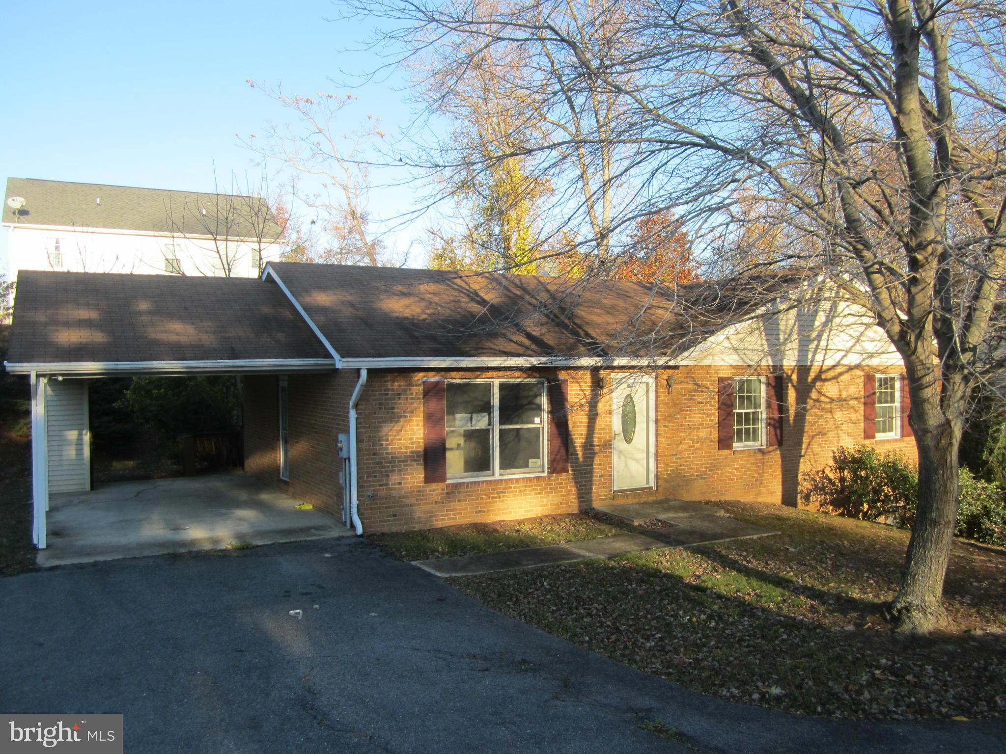 146 Calvert Towne Road Prince Frederick, MD 20678 - Photo 1 of 13 a front view of a house with a yard