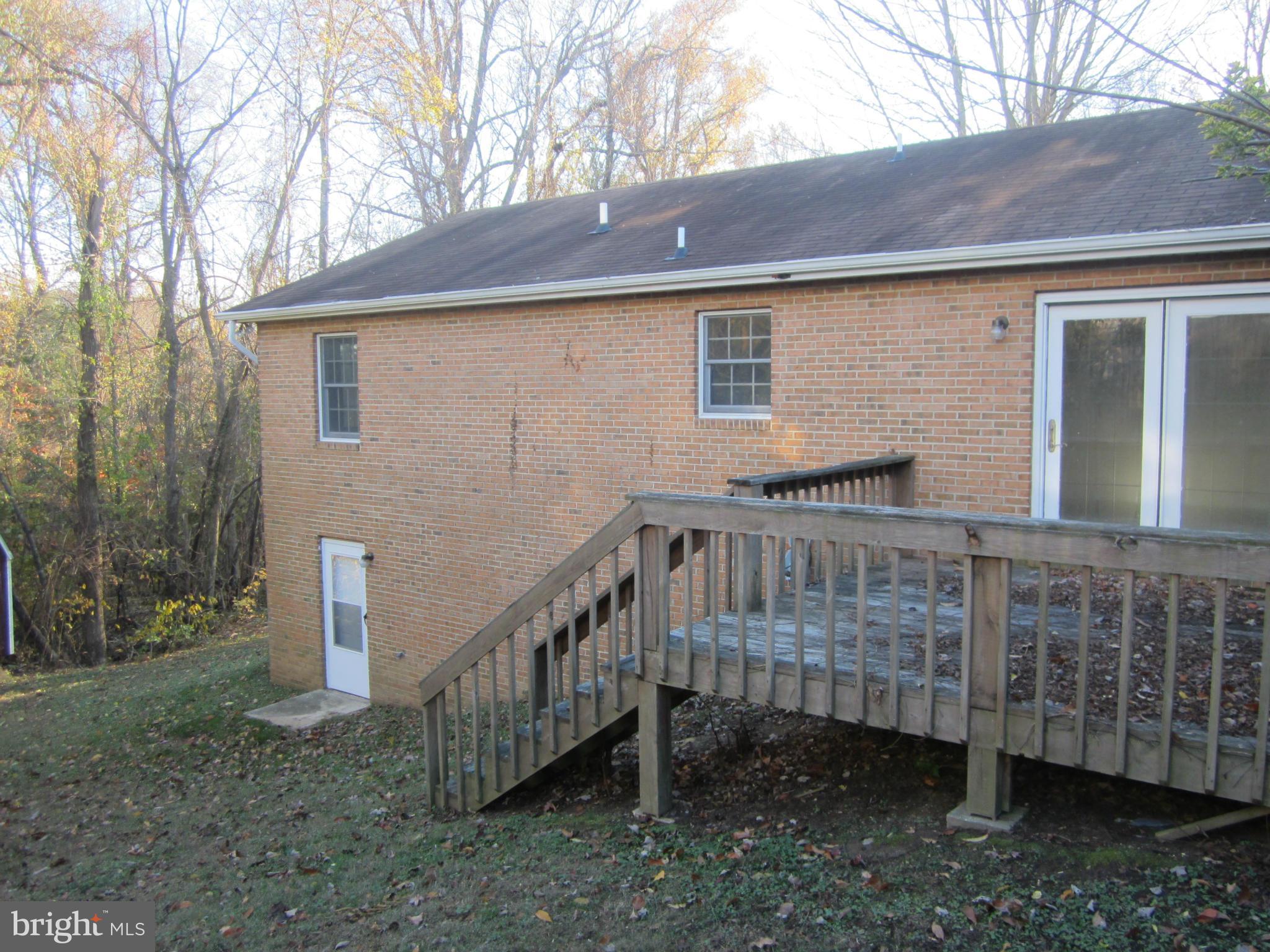 146 Calvert Towne Road Prince Frederick, MD 20678 - Photo 13 of 13 a backyard of a house with a yard deck and barbeque oven
