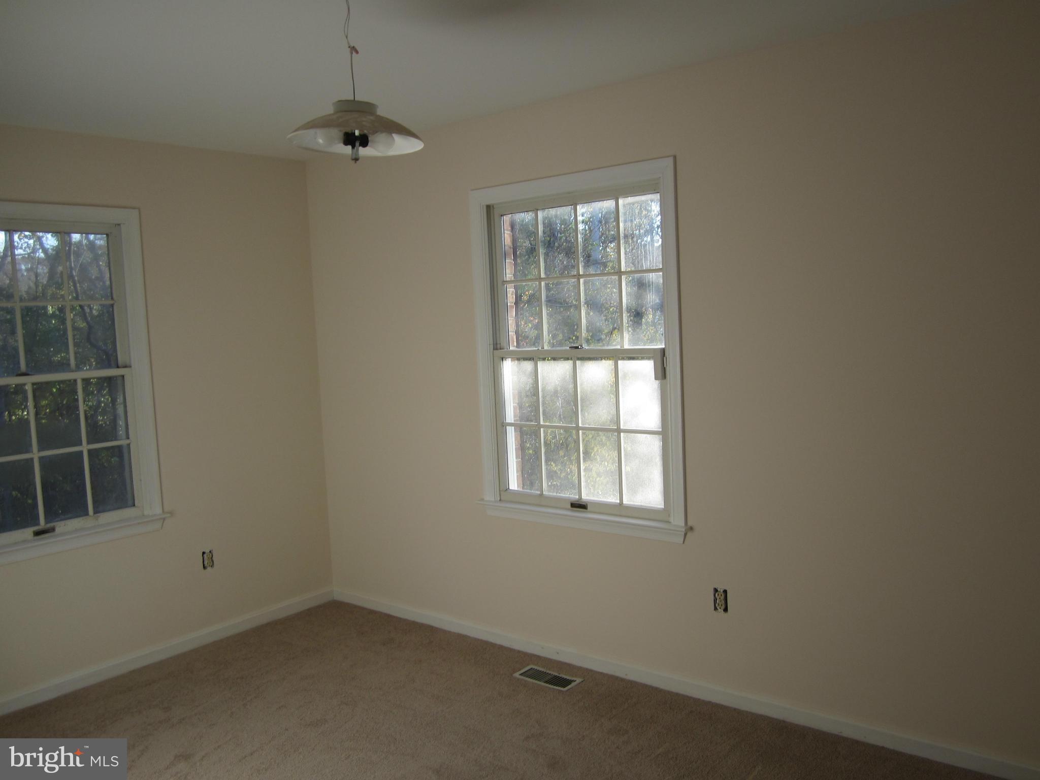 146 Calvert Towne Road Prince Frederick, MD 20678 - Photo 7 of 13 an empty room with windows